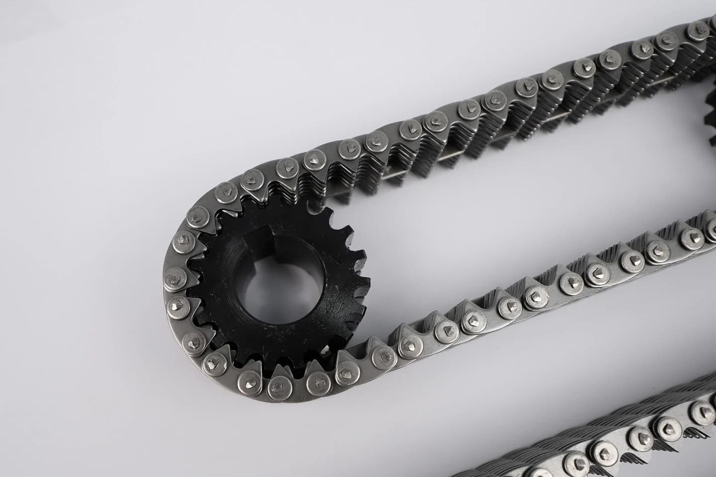 Chain wrapped around an existing sprocket on a light work surface