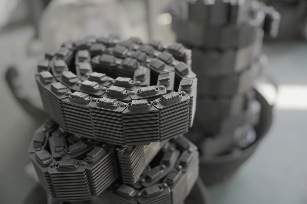 Several P.I.V. variable-speed chain assemblies stacked together