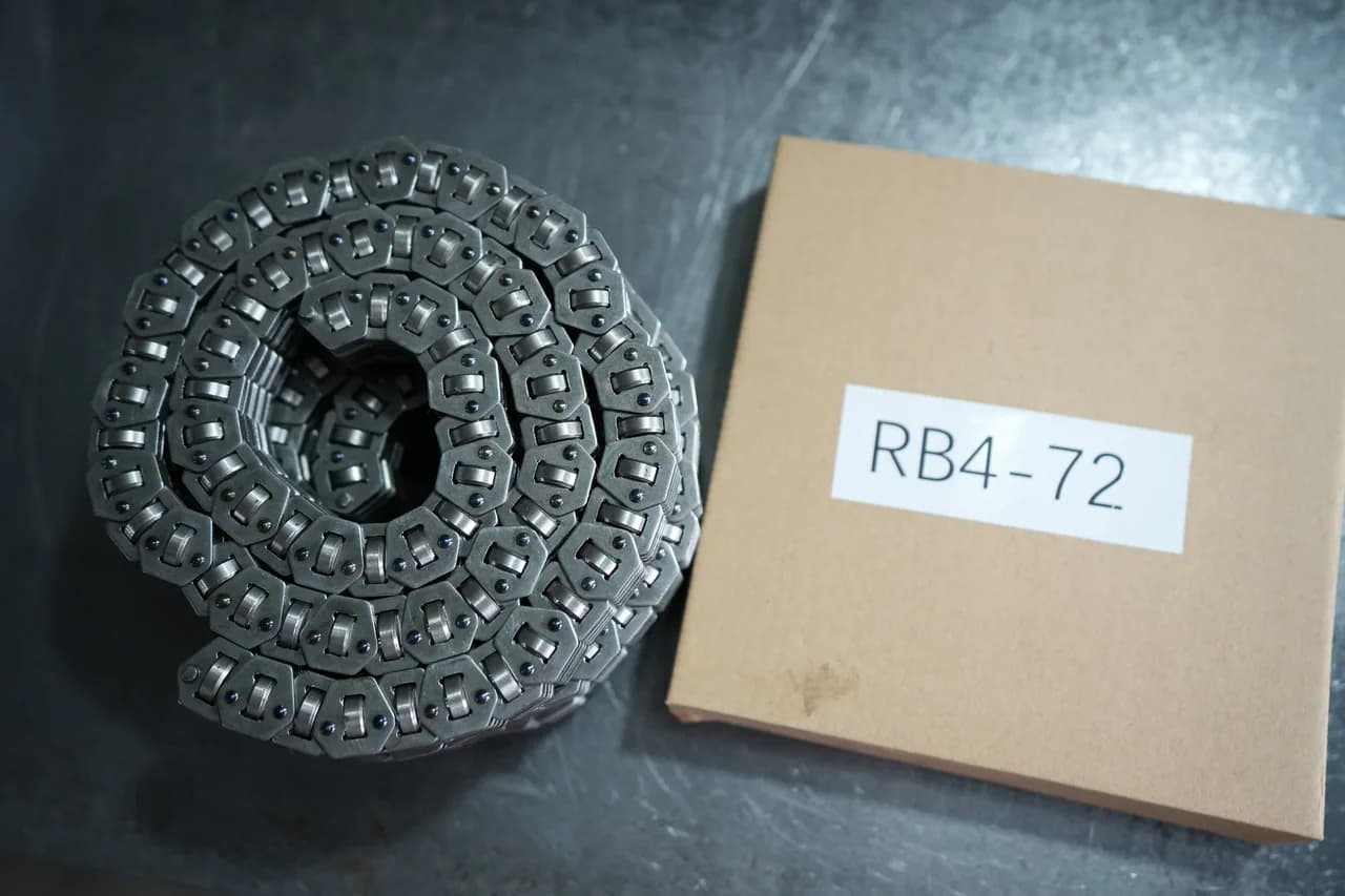 Coiled P.I.V. chain photographed beside an identification label
