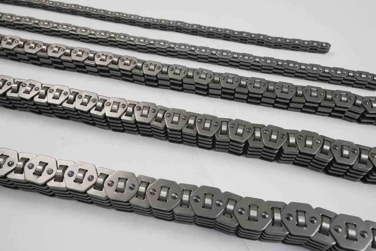 Several P.I.V. variable-speed chain constructions laid out in rows