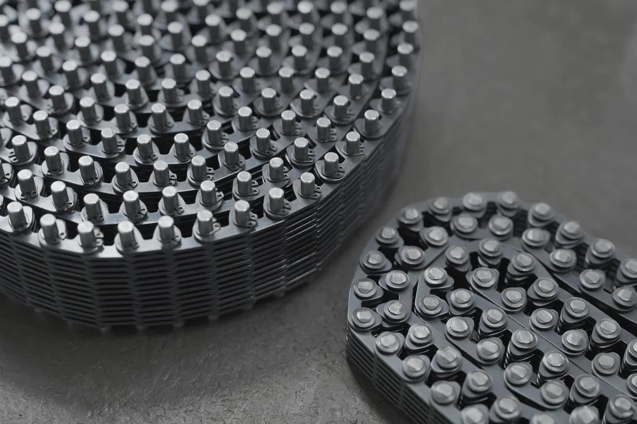 Two coiled silent-chain assemblies photographed from above