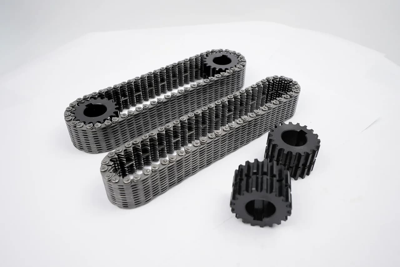 Two chain loops and separate sprockets arranged on a light surface