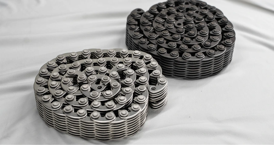 Two silent chains coiled on a light surface
